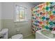 Bathroom featuring a window, bathtub and colorful shower curtain at 1860 Rosemont St, Salisbury, NC 28144