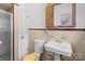 Tiled bathroom featuring a pedestal sink and a glass-doored shower at 1860 Rosemont St, Salisbury, NC 28144