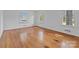 Bright bedroom with hardwood floors and three windows providing ample natural light at 1860 Rosemont St, Salisbury, NC 28144