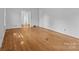 Spacious bedroom featuring hardwood floors and a doorway, offering a versatile living space at 1860 Rosemont St, Salisbury, NC 28144