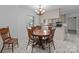 Cozy dining area with a traditional round table set and views into the functional kitchen space at 1860 Rosemont St, Salisbury, NC 28144