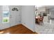 Inviting foyer with hardwood floors transitioning into a dining area with a classic table and kitchen view at 1860 Rosemont St, Salisbury, NC 28144