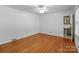 Light-filled bedroom with hardwood floors, a ceiling fan, and an en-suite bathroom for convenience at 1860 Rosemont St, Salisbury, NC 28144