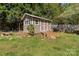 Charming shed with double doors, windows, ramp, and space for storage and outdoor projects at 1860 Rosemont St, Salisbury, NC 28144