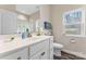 Bathroom featuring a double vanity, large mirror, and decorative window at 1870 Beth Haven Church Rd, Denver, NC 28037