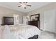 Bedroom featuring dark wood furniture, ceiling fan, and ensuite bathroom access at 1870 Beth Haven Church Rd, Denver, NC 28037