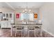 Bright dining room with a table for six, modern chandelier, and a cabinet for displaying fine china at 1870 Beth Haven Church Rd, Denver, NC 28037