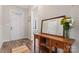 Bright entryway featuring wood floors, a stained-glass window above the door, and a wooden console table at 1870 Beth Haven Church Rd, Denver, NC 28037