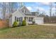 Charming home with manicured lawn, attractive landscaping, gray siding, black shutters, and attached garage at 1870 Beth Haven Church Rd, Denver, NC 28037