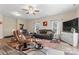 Open living room boasts hardwood floors, comfortable seating, and large windows that bring in plenty of natural light at 1870 Beth Haven Church Rd, Denver, NC 28037