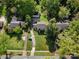An aerial view of a residential home featuring a well-manicured lawn at 1927 S Wendover Rd, Charlotte, NC 28211