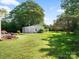Spacious backyard with a three car garage and beautiful landscaping; ideal for Gathering fun and outdoor gatherings at 1927 S Wendover Rd, Charlotte, NC 28211