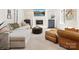Spacious living room featuring a fireplace, a comfortable sofa, and stylish furnishings at 1927 S Wendover Rd, Charlotte, NC 28211