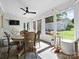 Bright sunroom featuring a ceiling fan, natural light, and views of the backyard, a perfect spot for relaxation at 1927 S Wendover Rd, Charlotte, NC 28211
