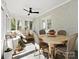 Inviting sunroom with comfortable seating, ceiling fan, and natural light, perfect for relaxation and entertaining at 1927 S Wendover Rd, Charlotte, NC 28211