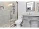 Bathroom featuring a glass shower, modern vanity, and gray tiling at 1930 Southridge Dr, Belmont, NC 28012