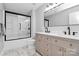 Modern bathroom featuring a double vanity with sleek fixtures and a black-framed shower at 1930 Southridge Dr, Belmont, NC 28012