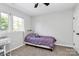Cozy bedroom featuring a single bed, neutral walls, and a bright window providing natural light at 1930 Southridge Dr, Belmont, NC 28012