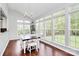 Bright dining area surrounded by large windows and hardwood flooring at 1930 Southridge Dr, Belmont, NC 28012