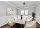 The dining room features a dining table with seating, complemented by wainscoting and a modern light fixture at 1930 Southridge Dr, Belmont, NC 28012