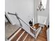 Bright foyer boasts hardwood floors, a staircase with white railings, and a modern chandelier fixture at 1930 Southridge Dr, Belmont, NC 28012
