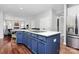 Kitchen island with blue cabinetry, granite countertops, and stainless steel appliances at 1930 Southridge Dr, Belmont, NC 28012