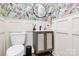 Charming powder room with vibrant wallpaper, wainscoting, and a stylish vanity at 1930 Southridge Dr, Belmont, NC 28012