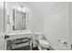 Contemporary bathroom with a modern vanity, sleek fixtures, and wood-look plank floors at 1976 Ferncliff Rd, Charlotte, NC 28211