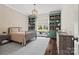 Inviting bedroom with custom built-in shelving and a charming window seat at 1976 Ferncliff Rd, Charlotte, NC 28211