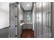 Elegant butler's pantry with gray cabinetry, wine cooler, and decorative backsplash at 1976 Ferncliff Rd, Charlotte, NC 28211