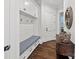 Welcoming entryway with built-in bench, storage cabinets, and stylish decor at 1976 Ferncliff Rd, Charlotte, NC 28211