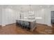 Bright kitchen with large island, pendant lighting, and modern appliances at 1976 Ferncliff Rd, Charlotte, NC 28211
