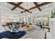 Spacious living room open to kitchen, featuring exposed beams and comfortable seating at 1976 Ferncliff Rd, Charlotte, NC 28211