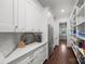 Walk-in pantry with ample shelving and countertop space at 1976 Ferncliff Rd, Charlotte, NC 28211