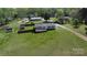 Wide aerial view of home with a large fenced-in yard, an additional storage building, and a long driveway at 2055 Cauble Rd, Salisbury, NC 28144