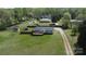 Expansive aerial view of the home and the property featuring a fence, and a large grassy yard at 2055 Cauble Rd, Salisbury, NC 28144