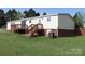 A spacious backyard featuring a multi-level deck with access to the home's interior at 2055 Cauble Rd, Salisbury, NC 28144