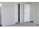 A clean bedroom view showcasing neutral walls, carpet and multiple closet doors for ample storage at 2055 Cauble Rd, Salisbury, NC 28144