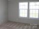 Bedroom with soft carpeting and natural light streaming through two windows, creating a serene retreat at 2055 Cauble Rd, Salisbury, NC 28144