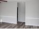 Hallway view showcasing modern flooring, neutral walls, and doorways leading to other rooms at 2055 Cauble Rd, Salisbury, NC 28144