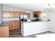 Modern kitchen with stainless steel appliances, wood cabinets, and a breakfast bar at 2055 Cauble Rd, Salisbury, NC 28144