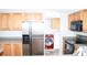 Modern kitchen showcasing stainless steel appliances, light cabinets, and a view of the laundry area at 2055 Cauble Rd, Salisbury, NC 28144