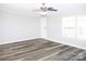 Bright living room with wood-look floors, neutral walls, natural light and a view of the front yard at 2055 Cauble Rd, Salisbury, NC 28144