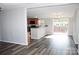 Open-concept living space with sleek flooring, connecting to a well-equipped kitchen and outdoor access at 2055 Cauble Rd, Salisbury, NC 28144