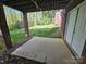 A covered back patio and small storage shed are set in a backyard with a manicured lawn at 210 35Th Ne Ave, Hickory, NC 28601