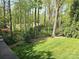 A beautiful backyard with wooded area seen from an elevated deck with a modern cable railing system at 210 35Th Ne Ave, Hickory, NC 28601