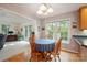 Cozy dining room with wood table set, adjacent to a living area and with natural light at 210 35Th Ne Ave, Hickory, NC 28601
