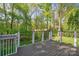 A beautiful back yard with a wooded area, seen from an elevated deck with a modern cable railing system at 210 35Th Ne Ave, Hickory, NC 28601