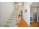 Entry foyer featuring hardwood floors, staircase, and views into adjacent rooms at 210 35Th Ne Ave, Hickory, NC 28601