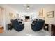 Spacious living room with fireplace, ceiling fans, and neutral carpeting at 210 35Th Ne Ave, Hickory, NC 28601